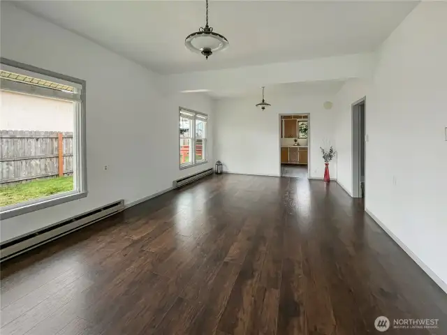 Living room has plenty of natural light and vinyl windows throughout the home.