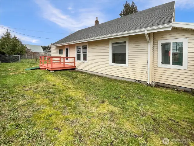 Fenced yard along with deck