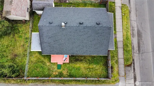 Porch off the side of the house and a shed in the back. Roof was installed around 2014