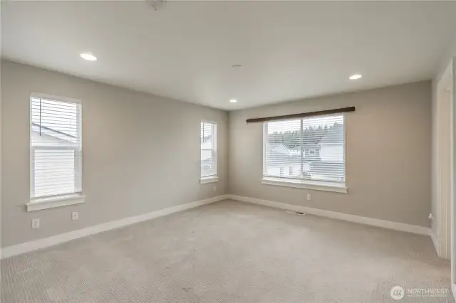 primary bedroom with arge bath and walk-in closet.