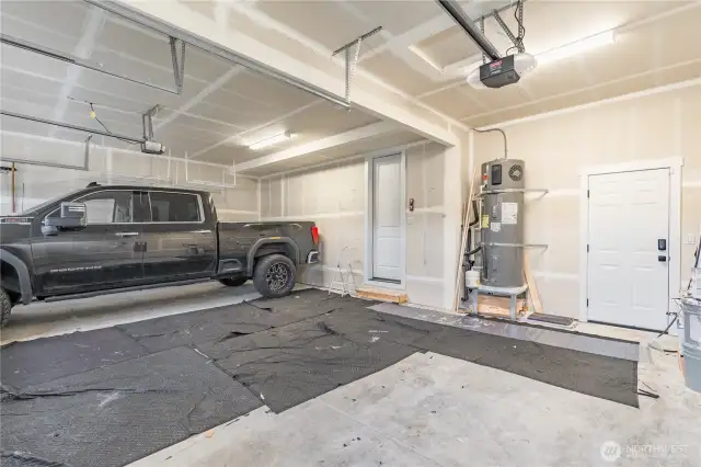 3 car garage with entrance to backyard