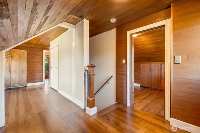 Upstairs landing with an office, den, or large closet to the left.