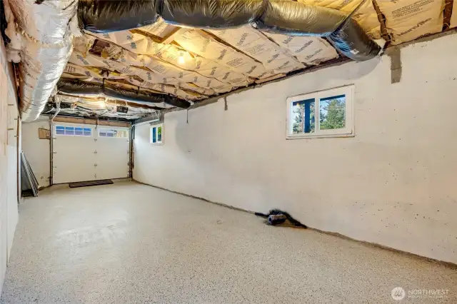 Long garage that can fit two compact cars.