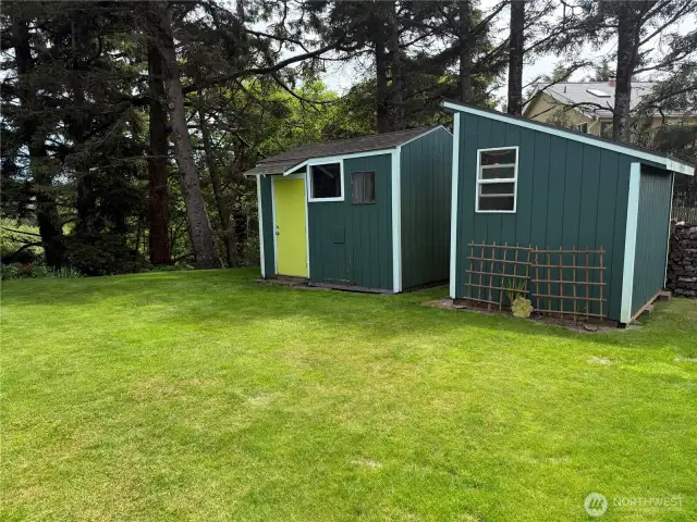 Outbuildings for different purposes, one for lawn care equipment and the other for storge and beach toys. materials.