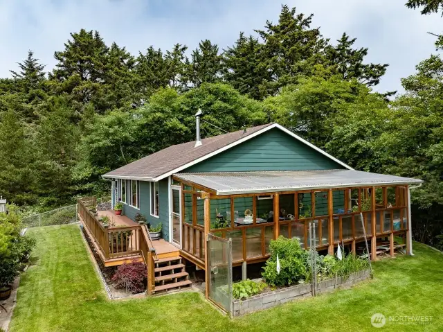 Included is this wonderful sunroom, perfect for entertaining in any type of weather. Plants love it too.