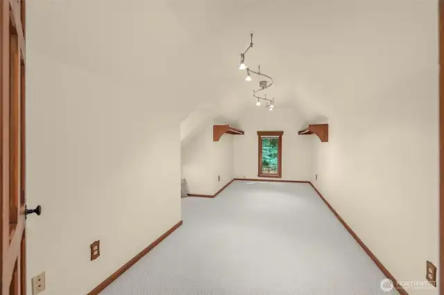 Walk in closet with space for a dressing area or reading nook.