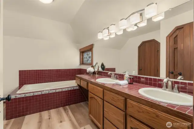 Full bath off master bedroom with soaking tub.