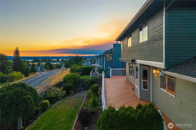 Deck overlooks the spacious backyard
