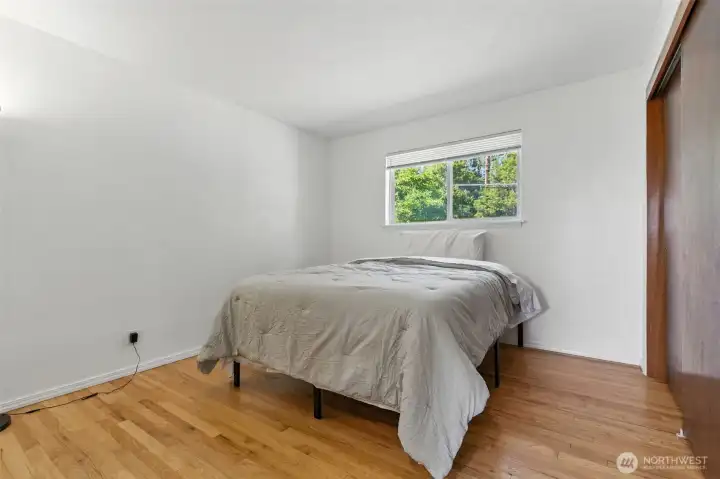 Third bedroom with original hardwood floors