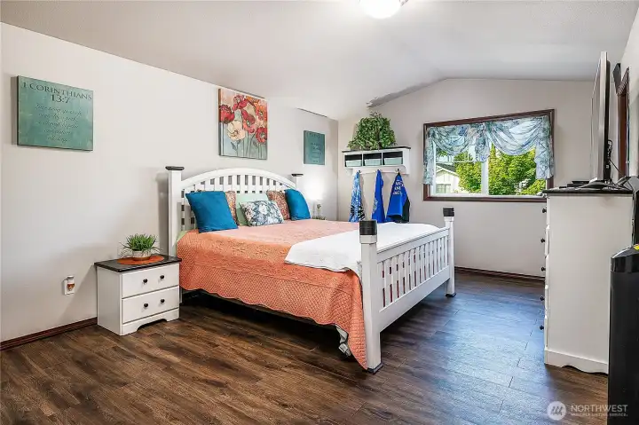 HUGE Primary suite with vaulted ceilings, it's own private bathroom, sitting area AND a large walk in closet!