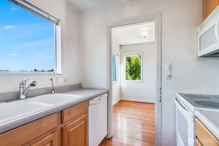 Another kitchen view showing the access to the dining area.
