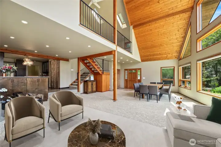 Custom storage cabinets under open staircase and on peninsula  Large storage cubby under stairs / Closet  Virtually staged