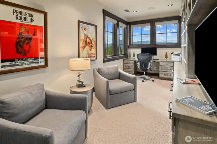 Loft with built in cabinets and work space