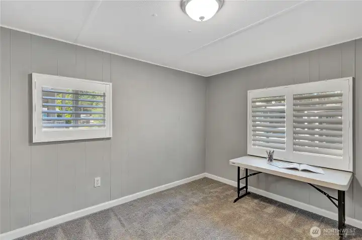 Bedroom #2  These attractive window shutters are throughout the home.