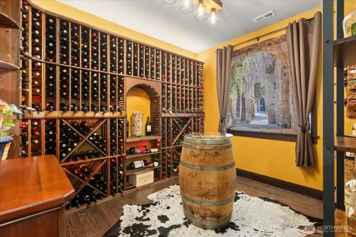 Main level room currently styled as a wine cellar. Space is perfect for a flex space-home gym- 2nd office or guest space.