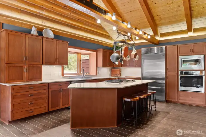 Wolf gas range and open floor plan to allow for cooking and socializing at the same time. Wolf gas range and open floor plan to allow for cooking and socializing at the same time.