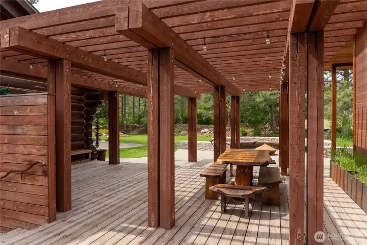 Impressively massive, custom outdoor table and benches stay with the home. Impressively massive, custom outdoor table and benches stay with the home.