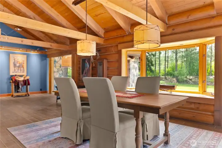 Large windows bring in abundant natural light and frame peaceful views of the private, park-like backyard and surrounding mountains. Large windows bring in abundant natural light and frame peaceful views of the private, park-like backyard and surrounding mountains.