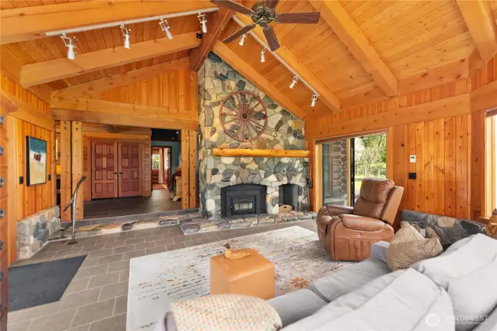 River rock mantel continues to wrap around living room lends an established sense of understated grandeur. River rock mantel continues to wrap around living room lends an established sense of understated grandeur.