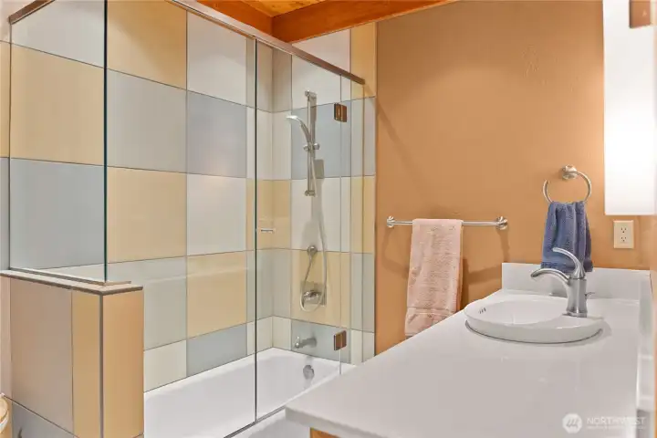 Second modernized bathroom with tub. Stacked washer and dryer located in this bathroom as well. Second modernized bathroom with tub. Stacked washer and dryer located in this bathroom as well.
