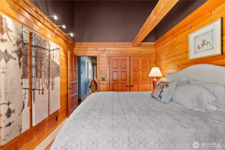 Guest bedroom with modern cable lighting and high ceilings. Guest bedroom with modern cable lighting and high ceilings.