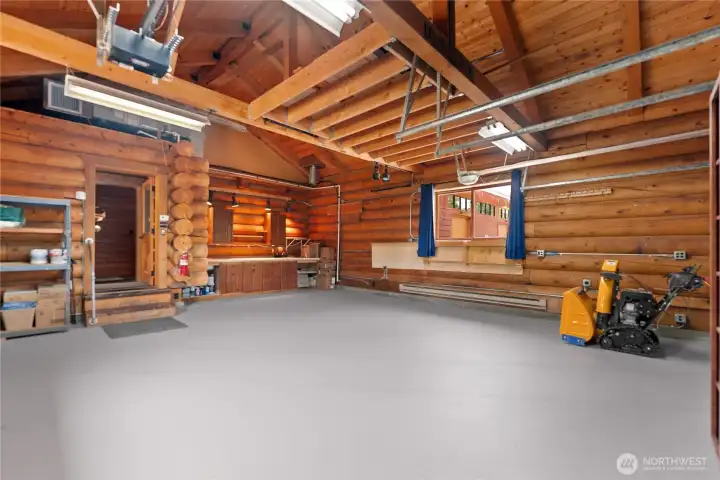 Attached two car garage with dedicated AC unit and baseboard heating. Stay cool or warm as you tube up that bicycle, tinker on your climate controlled workbench, or wax your skis. Attached two car garage with dedicated AC unit and baseboard heating. Stay cool or warm as you tube up that bicycle, tinker on your climate controlled workbench, or wax your skis.