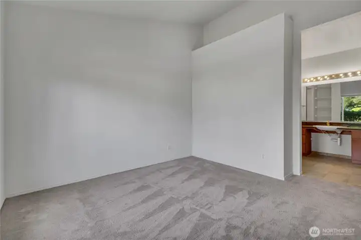 Primary suite with vaulted ceilings