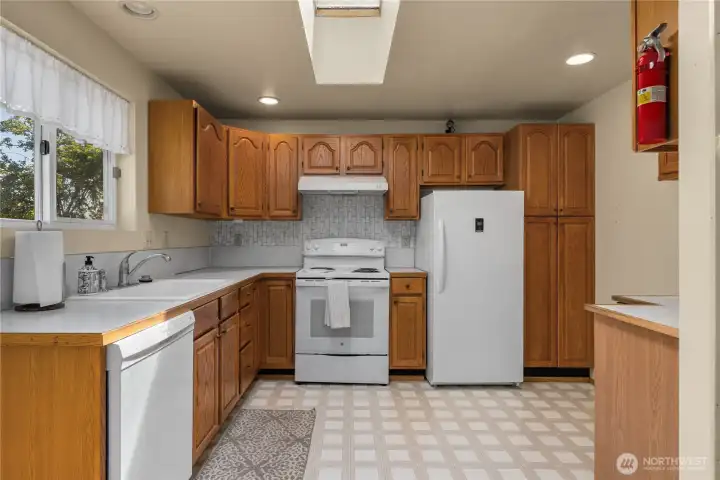 Spacious kitchen with plenty off cabinet storage and counter space.