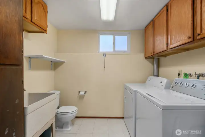 Spacious utility rooming lower.