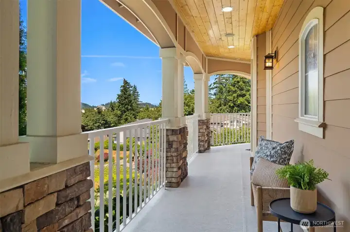 An expansive covered front wrap-around porch provides the perfect place to relax and enjoy the peaceful surroundings with views toward the neighborhood and beyond. An expansive covered front wrap-around porch provides the perfect place to relax and enjoy the peaceful surroundings with views toward the neighborhood and beyond.
