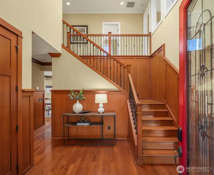 Step inside to soaring ceilings, abundant natural light, rich millwork, and warm hardwood floors that create an immediate sense of elegance and timeless craftsmanship. Step inside to soaring ceilings, abundant natural light, rich millwork, and warm hardwood floors that create an immediate sense of elegance and timeless craftsmanship.