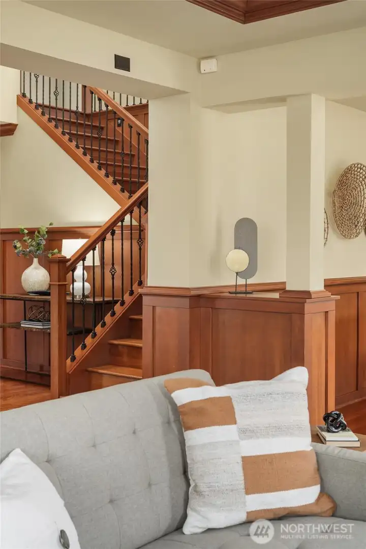 The home's central staircase serves as both a striking architectural feature and the heart of a floor plan designed for connection and comfortable living. The home's central staircase serves as both a striking architectural feature and the heart of a floor plan designed for connection and comfortable living.