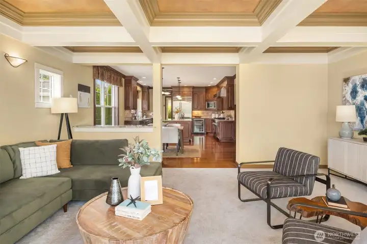 Anchored by a dramatic coffered ceiling, the spacious great room flows effortlessly into the chef's kitchen, creating the perfect gathering space. Anchored by a dramatic coffered ceiling, the spacious great room flows effortlessly into the chef's kitchen, creating the perfect gathering space.