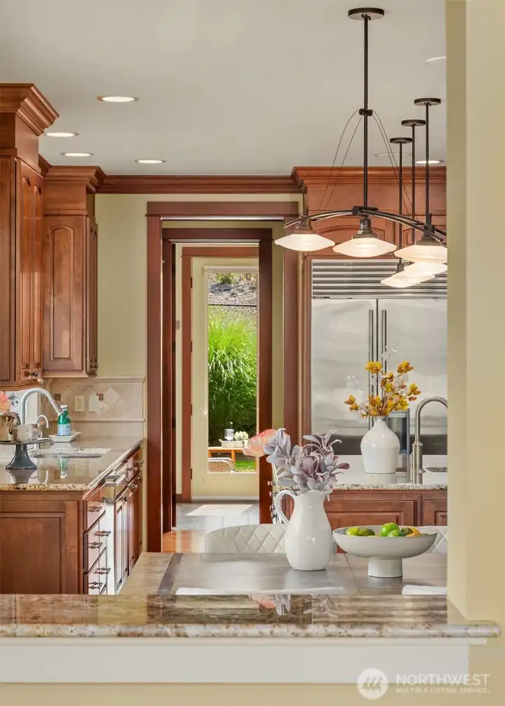 Thoughtfully designed sightlines connect the kitchen, casual dining area, and outdoor living spaces, creating an effortless rhythm for everyday life. Thoughtfully designed sightlines connect the kitchen, casual dining area, and outdoor living spaces, creating an effortless rhythm for everyday life.