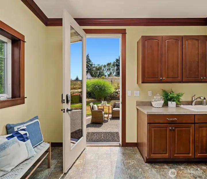 Conveniently located off the kitchen, the mudroom provides direct access to the backyard, making indoor-outdoor living and everyday routines feel seamless. Conveniently located off the kitchen, the mudroom provides direct access to the backyard, making indoor-outdoor living and everyday routines feel seamless.