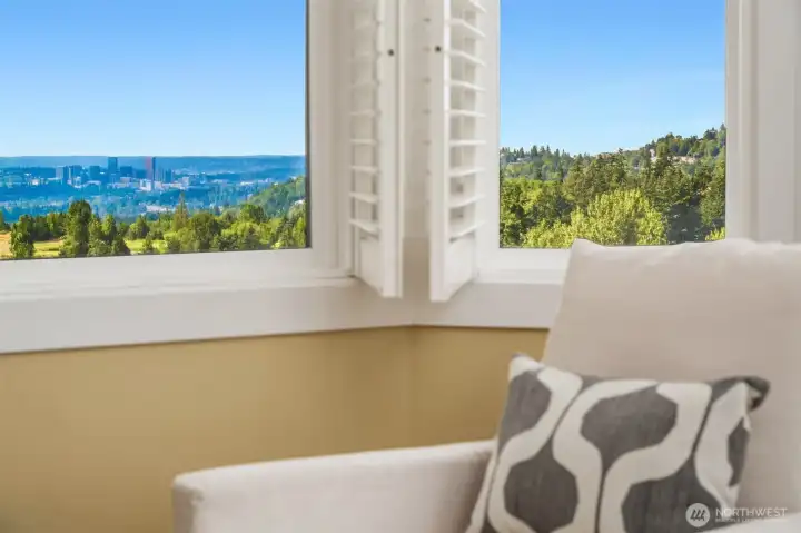 A wall of windows frames picturesque outlooks, bringing natural light and distant views into the heart of the primary retreat. A wall of windows frames picturesque outlooks, bringing natural light and distant views into the heart of the primary retreat.