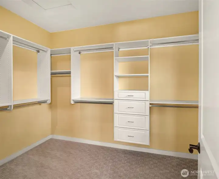 Designed for effortless organization, the expansive walk-in closet features built-in cabinetry, drawers, and abundant storage. Designed for effortless organization, the expansive walk-in closet features built-in cabinetry, drawers, and abundant storage.