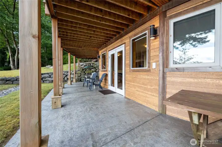Patio outside daylight basement w/ french doors