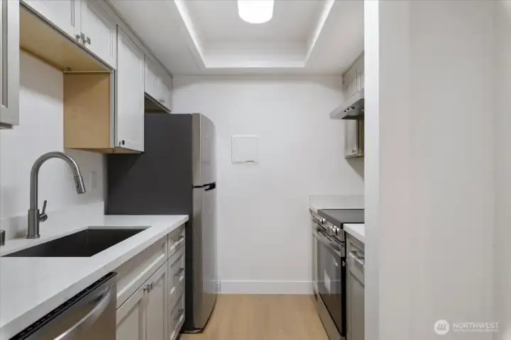 Solid wood cabinets with soft close hardware, luxurious quartz counters and brand new appliances. Generous pantry closet for additional storage! Solid wood cabinets with soft close hardware, luxurious quartz counters and brand new appliances. Generous pantry closet for additional storage!
