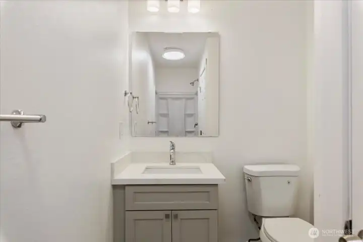 Primary bath with solid wood cabinets, quartz counters with undermount sink. Primary bath with solid wood cabinets, quartz counters with undermount sink.