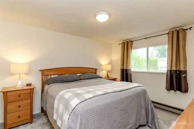 Spacious primary suite is large enough for King size bed and your favorite furnishings.