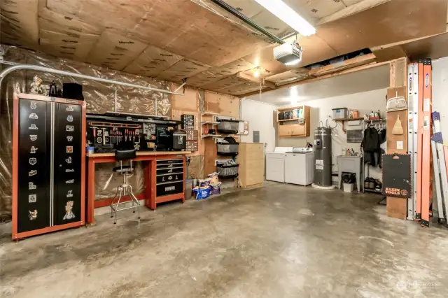 So much to see here! Work bench, laundry organizer, washer, dryer and even a ladder to get to the storage area above will be provided to buyer from the seller! Brand new hot water tank too!