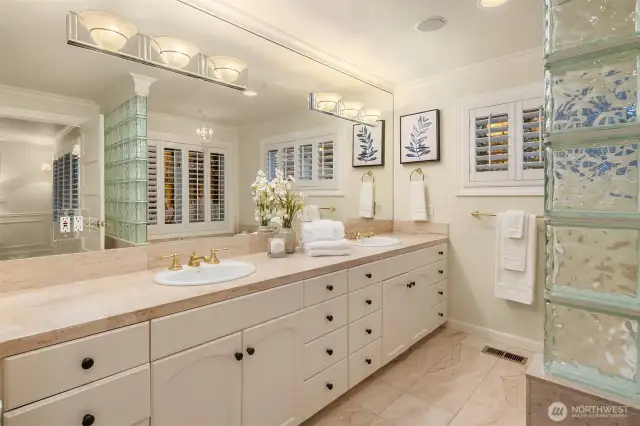 A spa like primary bathroom with perfect bones for customizing or making it your own.
