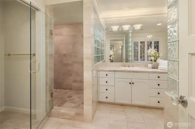 This shower space is gigantic! The whole family could clean up in this shower area.