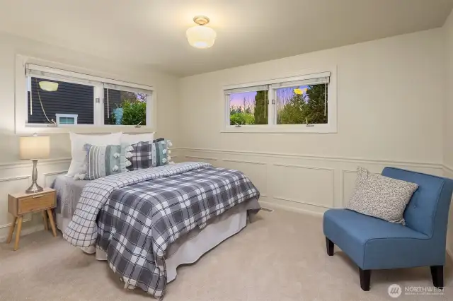 Charming bedroom (one of 3 upstairs) is roomy yet cozy and features windows on two sides with custom Hunter Douglas blinds.