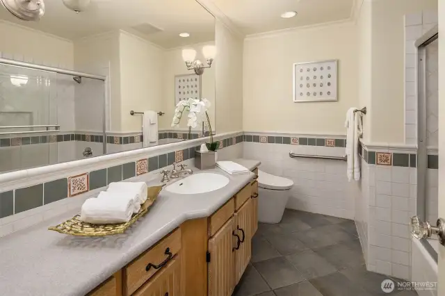 A full guest bathroom on the main floor features toasty heated floors for those days when you really need it!