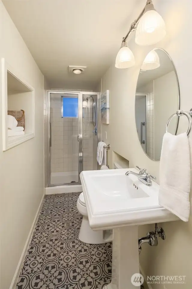 Refreshed & cute lower level 3/4 bath.