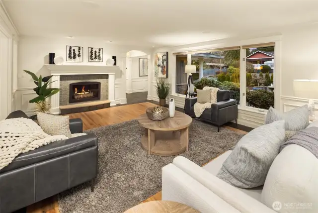A grand fireplace with a richly detailed mantel and surround serves as a focal point in the room anchoring the space and providing an incredible feeling of warmth!