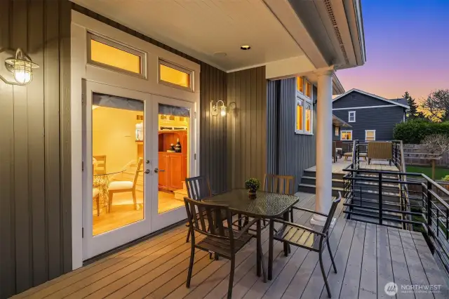 Another dining or seating area off of the French doors to the main house.  Note the meticulous paint job on the exterior. Everything has been maintained to perfection.
