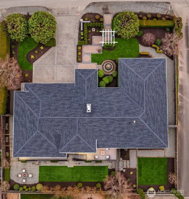 An aerial view of the grounds depicting the extensive hardscapes, the manicured grounds and the brand spanking new 40 year roof.